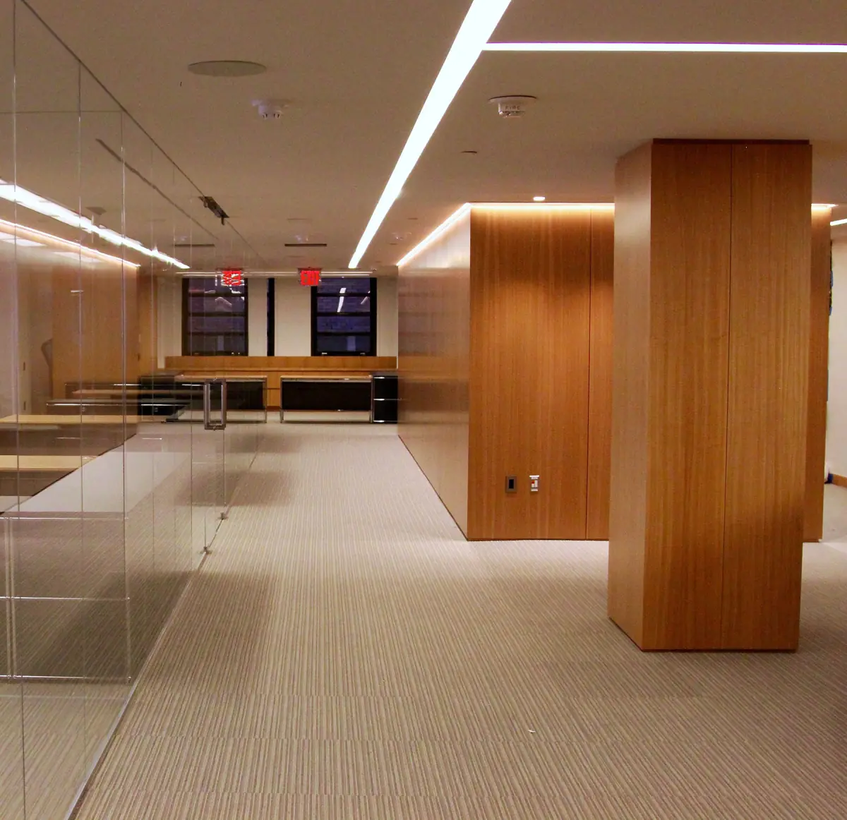 Anigre wood columns and glass partitions in a Park Avenue office built by E.J. York